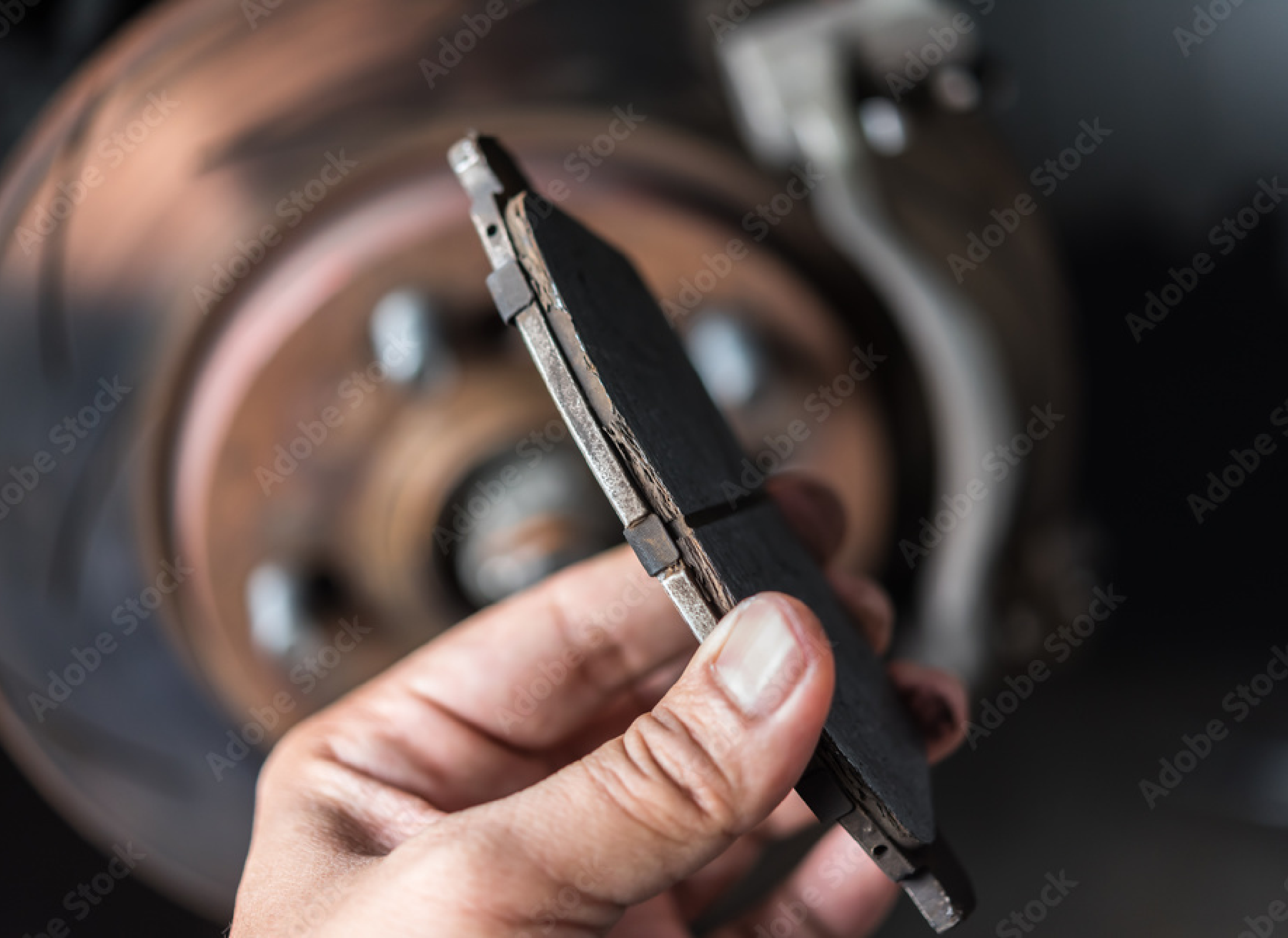 Image of a worn brake pad. Concept image of brake repair at Brittni's Automotive.